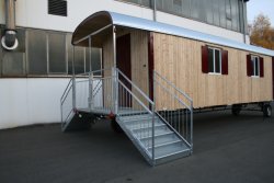 Entry on one end with overhang and platform, two 5-step galvanized stairways suitable for children with step-through protection and second handrail.