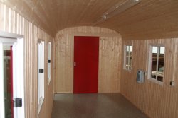 Optional inner wall and ceiling paneling made of profiled wood.