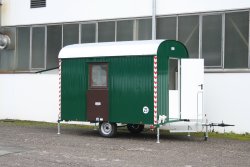 <h5>WEIRO® personnel trailers</h5>with outer sheet steel paneling and height-adjustable towing devices for up to 25 kmh, overhead workshop door.