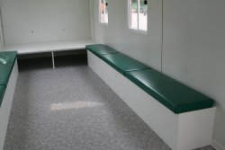 Furnishing example with padded seats suitable for children and a place for lying down at the end.