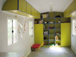 Furnishing example with wall cupboard built into the curved roof and a combination cabinet/shelf wall unit.