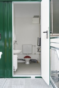 Separate toilet compartment accessible from outside, equipped so it is suitable for children.