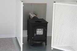 Optional wood-burning stove with protective grating.