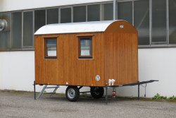 Weiro construction trailer suitable for small groups with wood outer paneling, 3.50 m long, with 4 wood tilt and turn windows.
