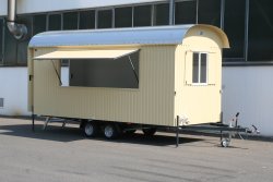 <h5>WEIRO® sales trailer</h5>with 5 m body length, tandem chassis, outer paneling made of galvanized, painted sheet steel, overhead door on side, and entryway at the rear.